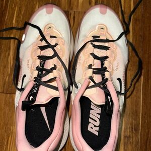 One pair of women’s size 7.5 Nike react tennis shoes